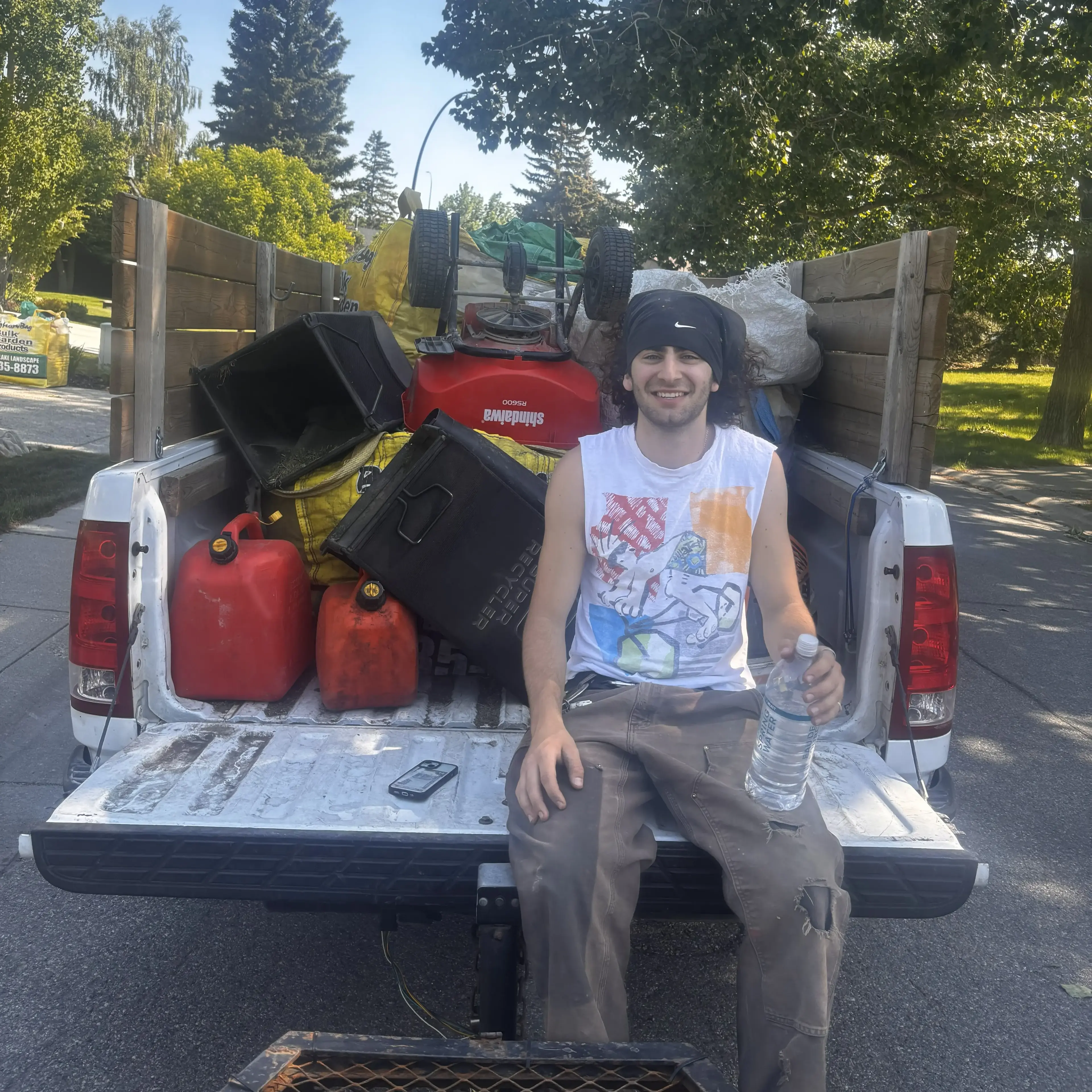 Landscaping crew preparing equipment before service